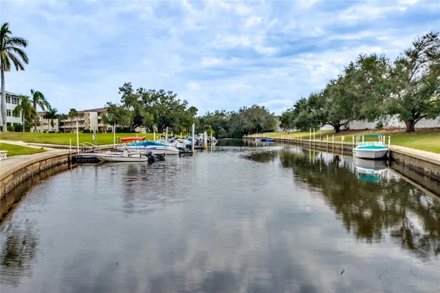 a view of a lake with boats and trees