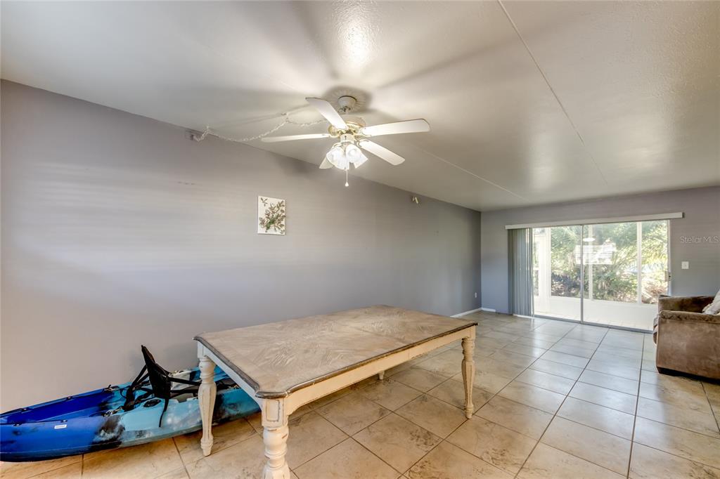 1003 Tropic Terrace North Fort Myers, FL 33903 - Photo 4 of 35 a room with furniture and window