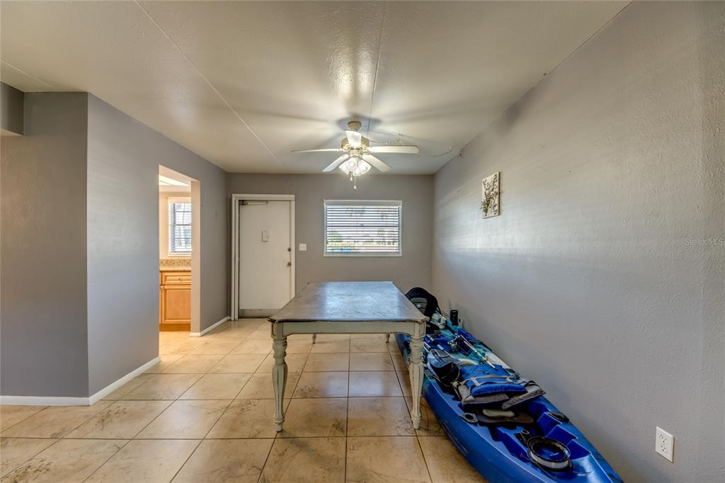 1003 Tropic Terrace North Fort Myers, FL 33903 - Photo 7 of 35 a room with window and wall paintings
