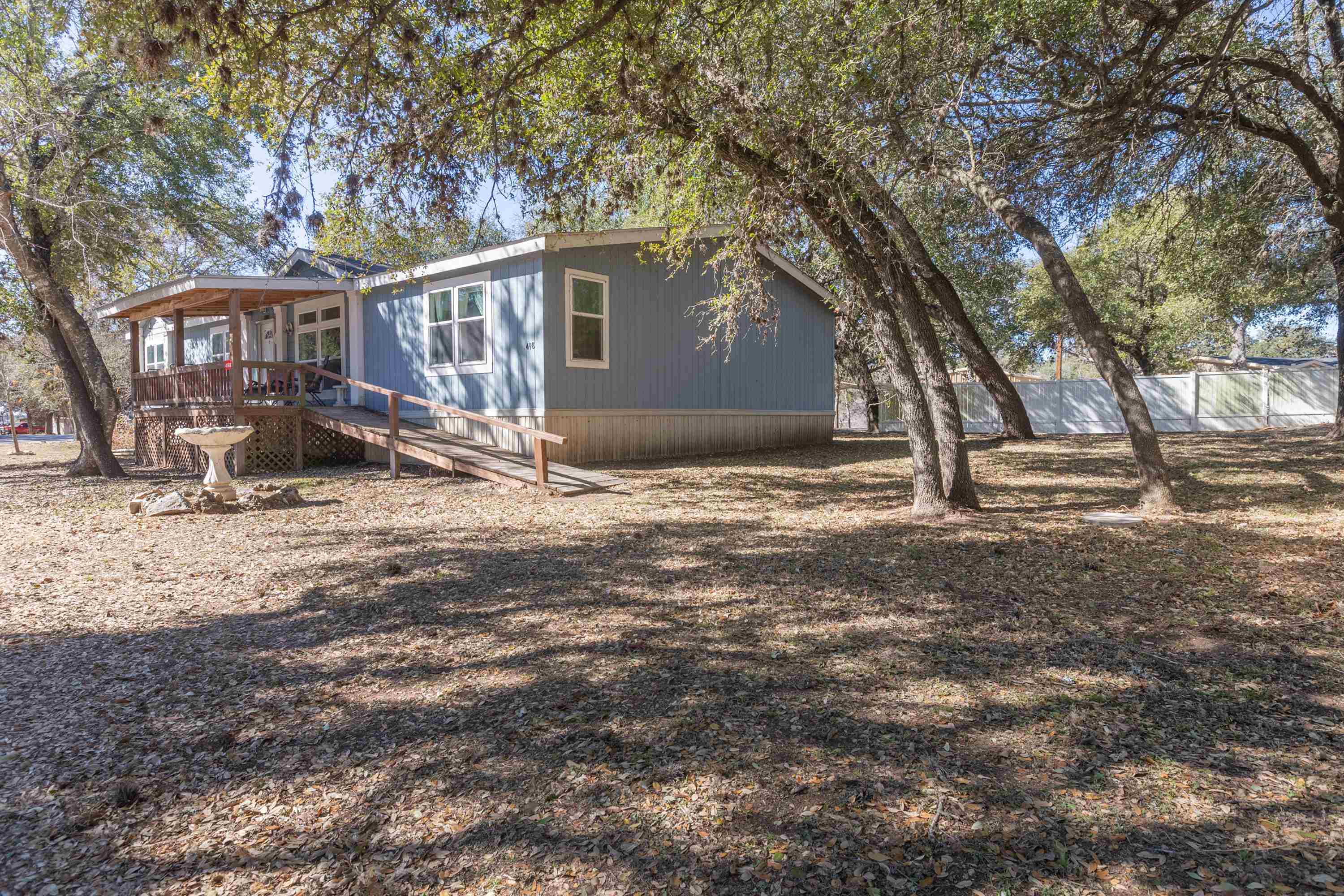 a view of a house with a yard covered with snow in the yard