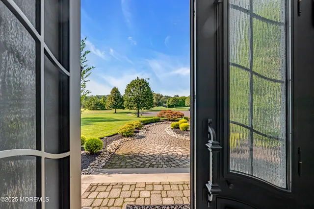 a living room with furniture rug and a potted plant