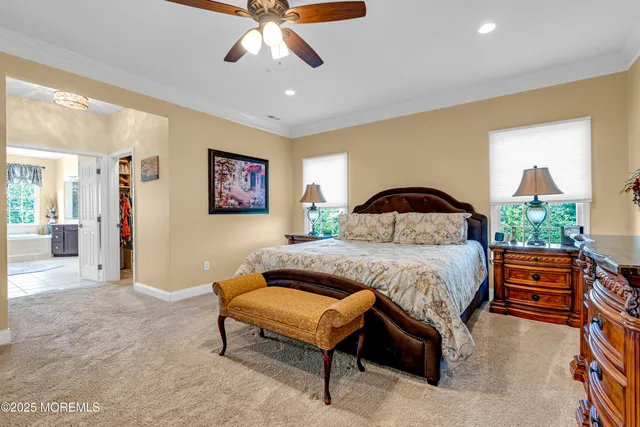 an aerial view of a house with a swimming pool outdoor seating and yard