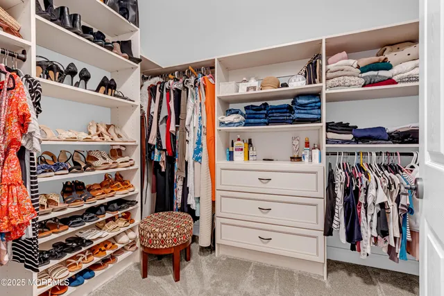 an aerial view of a house with swimming pool and outdoor seating