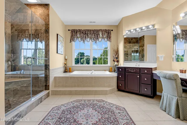 an aerial view of a house with a yard basket ball court and outdoor seating