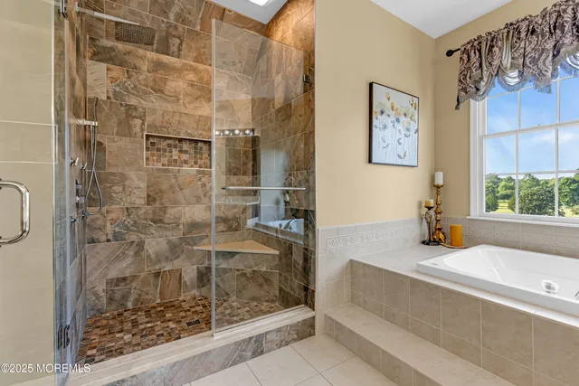 an aerial view of a house with garden space lake and outdoor seating