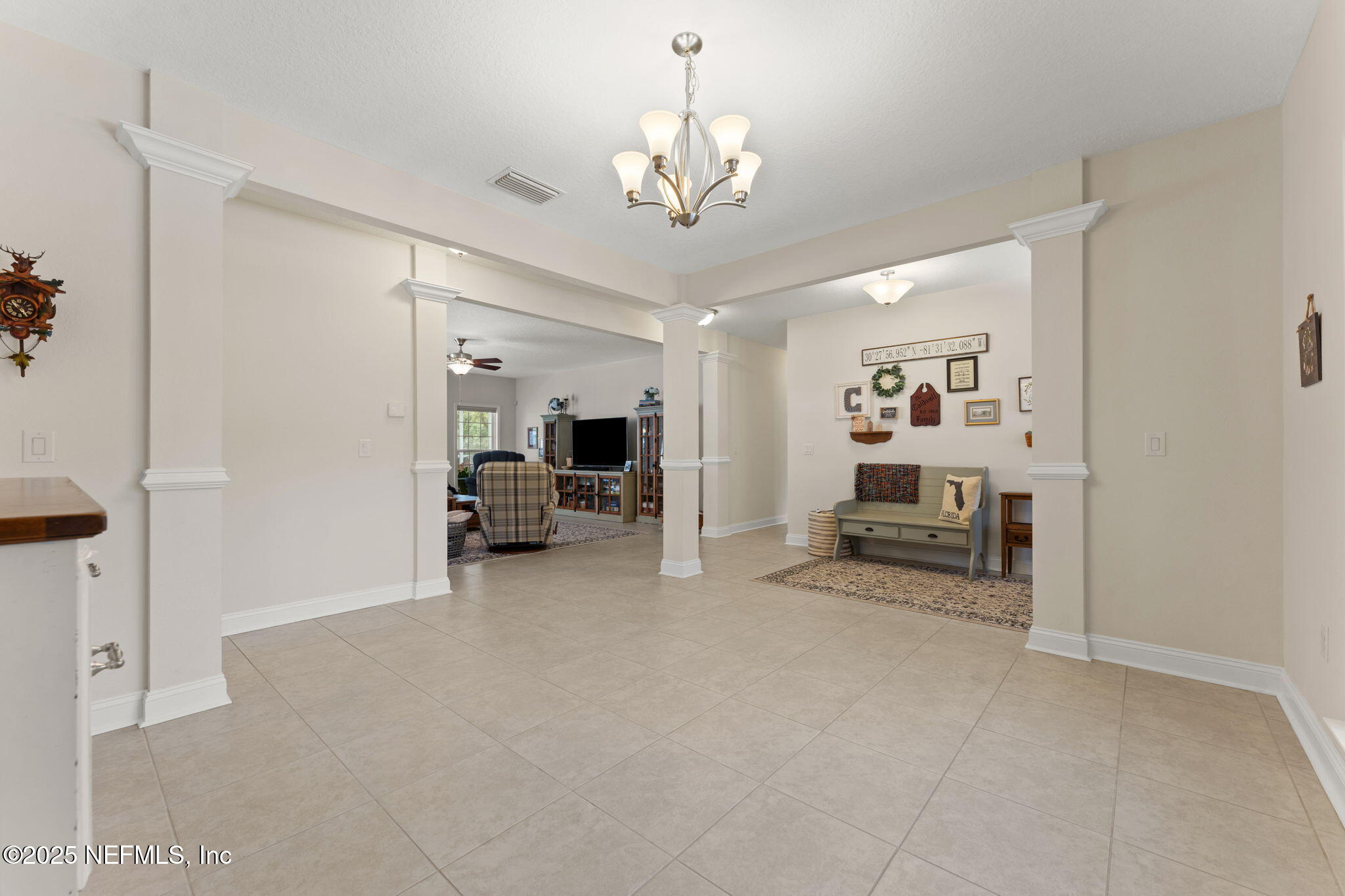 12869 Boney Road Jacksonville, FL 32226 - Photo 14 of 62 a view of a livingroom with a furniture staircase and a ceiling fan