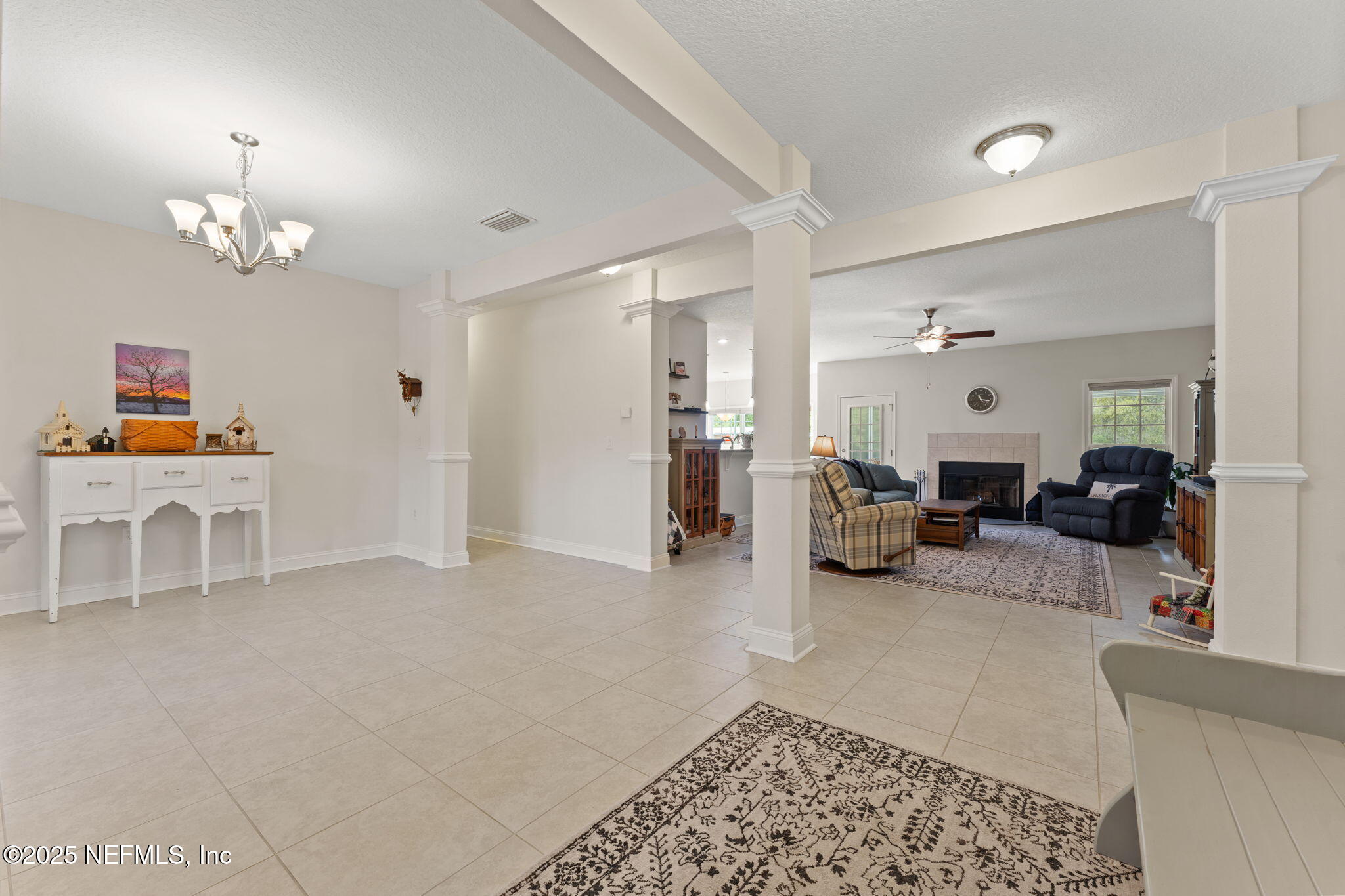 12869 Boney Road Jacksonville, FL 32226 - Photo 15 of 62 a living room with furniture and a chandelier