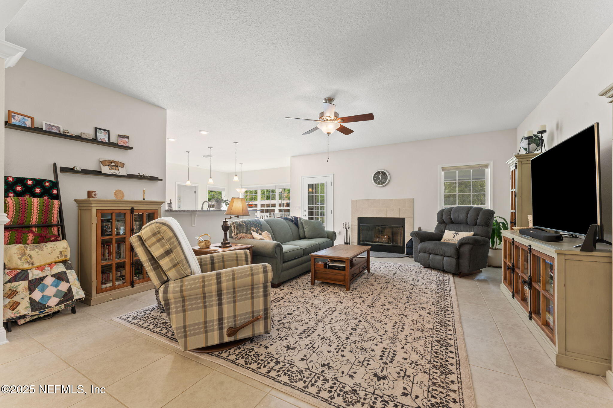 12869 Boney Road Jacksonville, FL 32226 - Photo 16 of 62 a living room with furniture and a flat screen tv