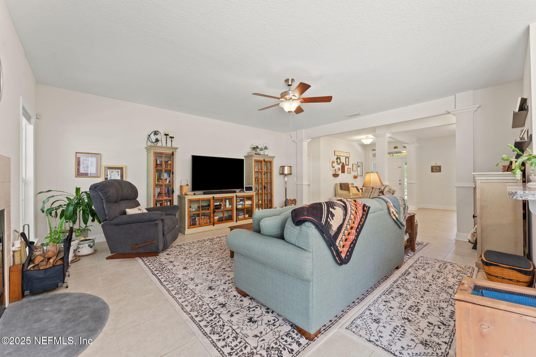 12869 Boney Road Jacksonville, FL 32226 - Photo 17 of 62 a living room with furniture and a flat screen tv