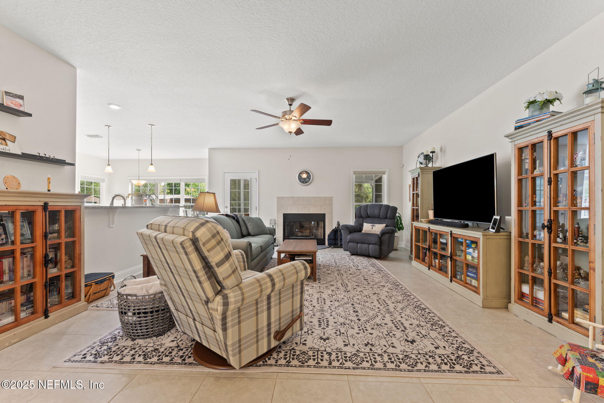 12869 Boney Road Jacksonville, FL 32226 - Photo 18 of 62 a living room with furniture and a flat screen tv