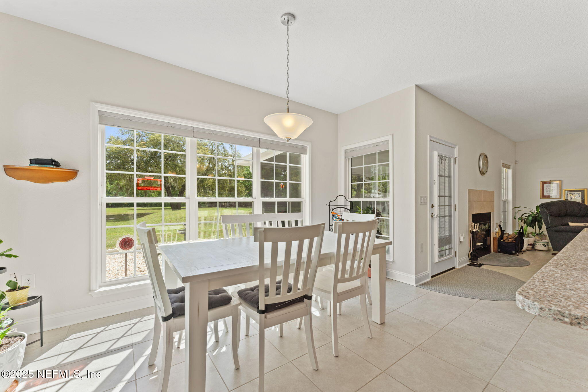 12869 Boney Road Jacksonville, FL 32226 - Photo 23 of 62 a view of a dining room with furniture window and outside view