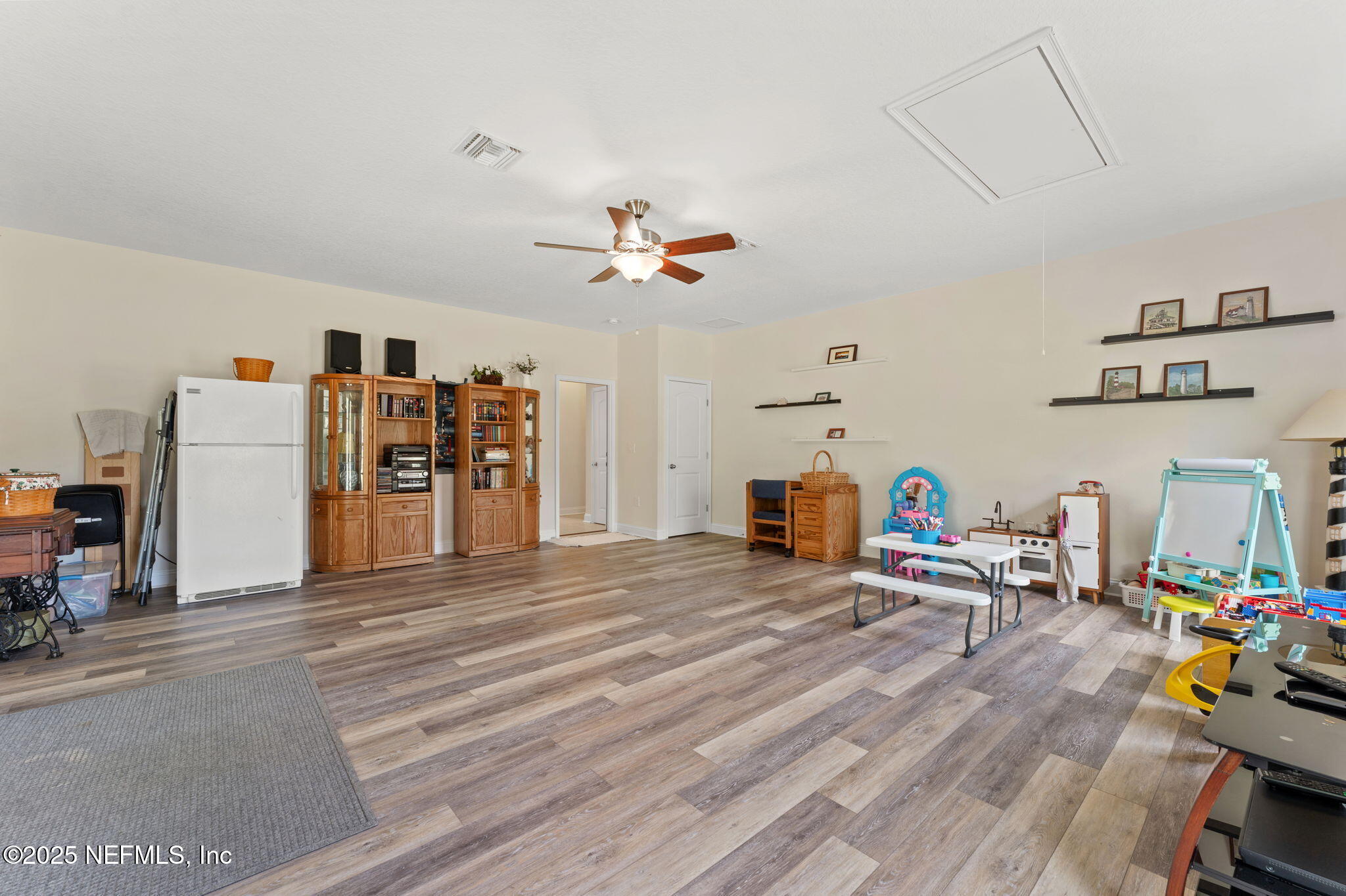 12869 Boney Road Jacksonville, FL 32226 - Photo 31 of 62 a living room with furniture and a chandelier