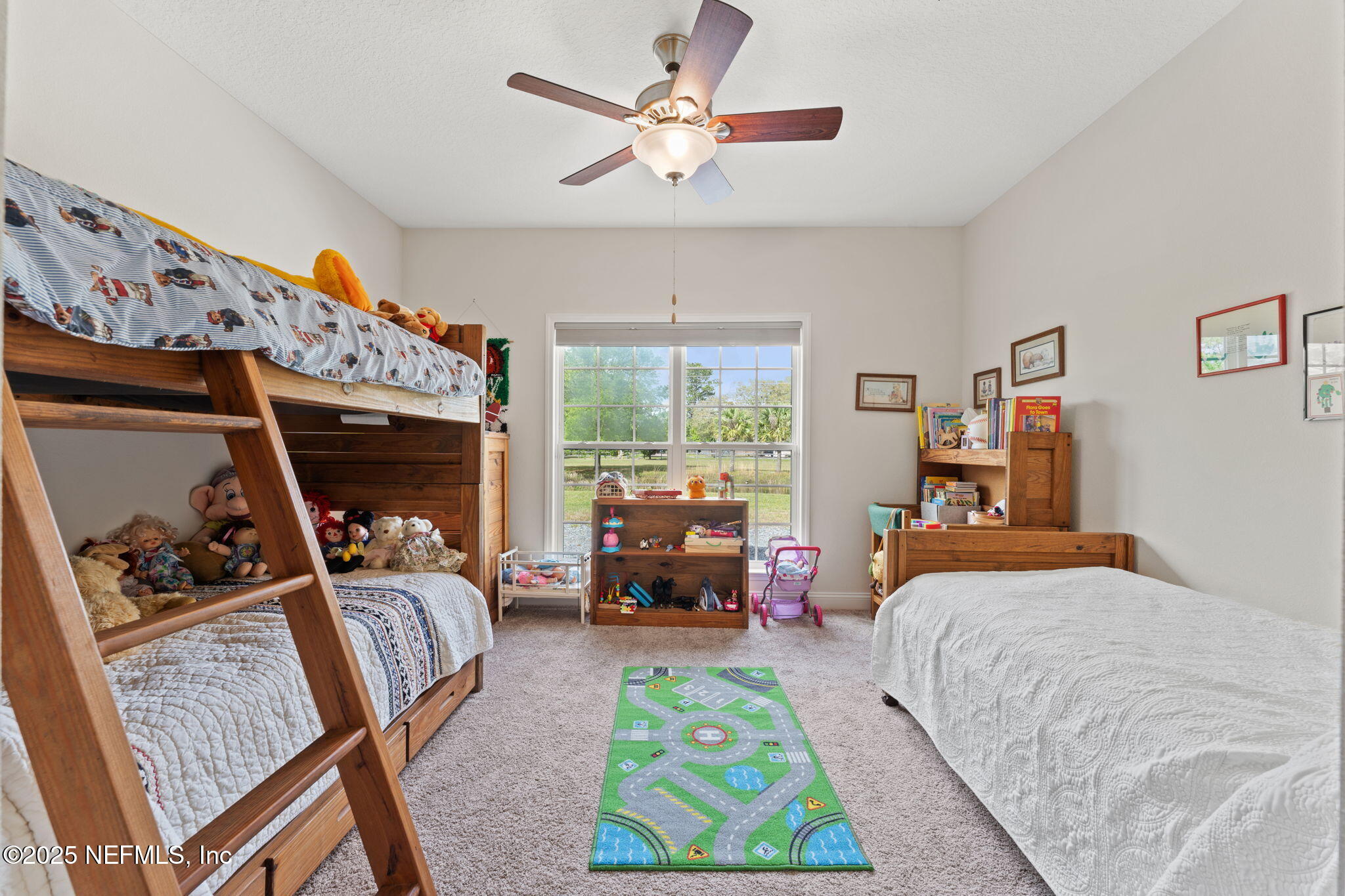 12869 Boney Road Jacksonville, FL 32226 - Photo 39 of 62 a bedroom with furniture and a large window