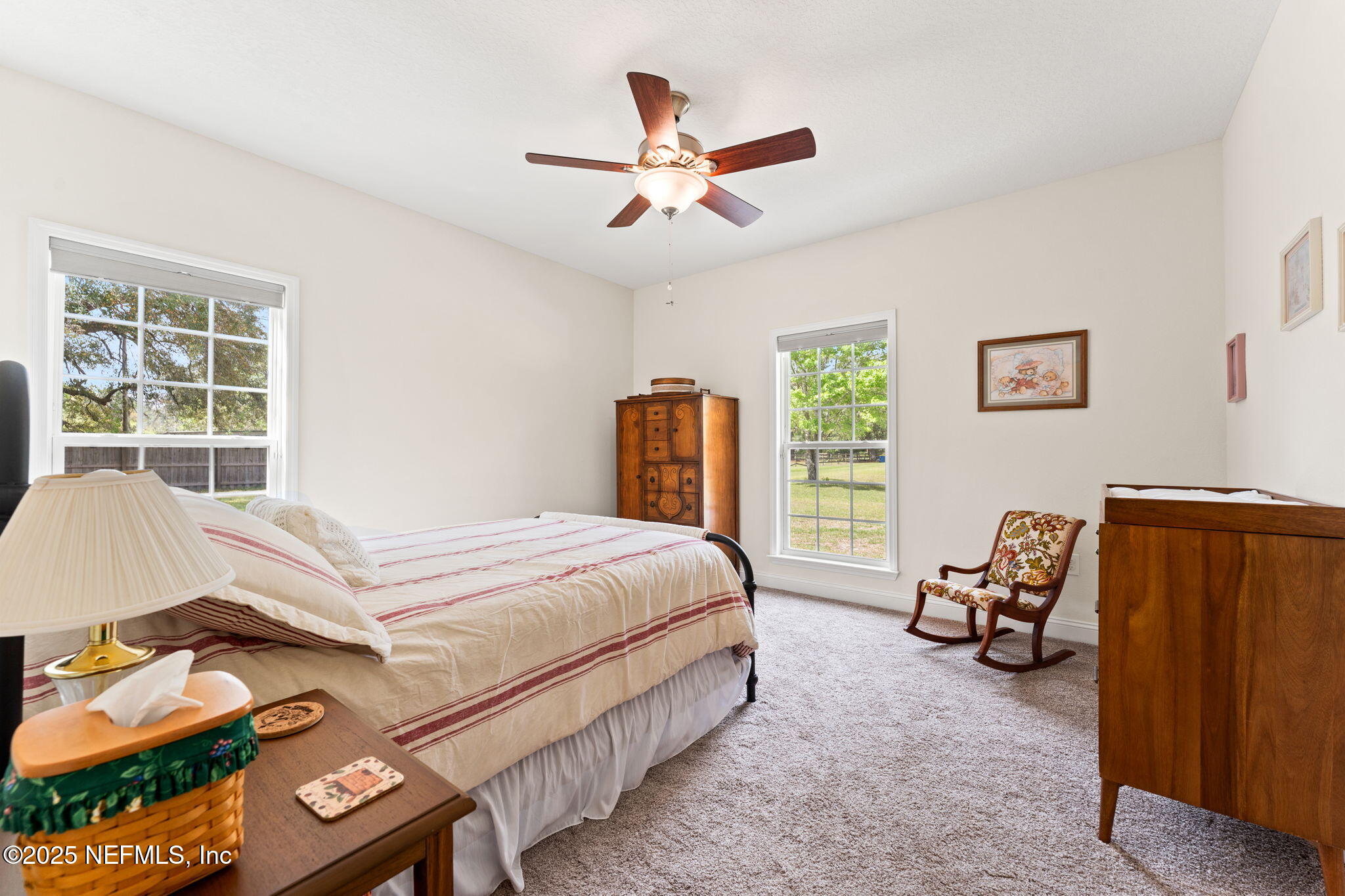 12869 Boney Road Jacksonville, FL 32226 - Photo 40 of 62 a bed room with a bed and a chair