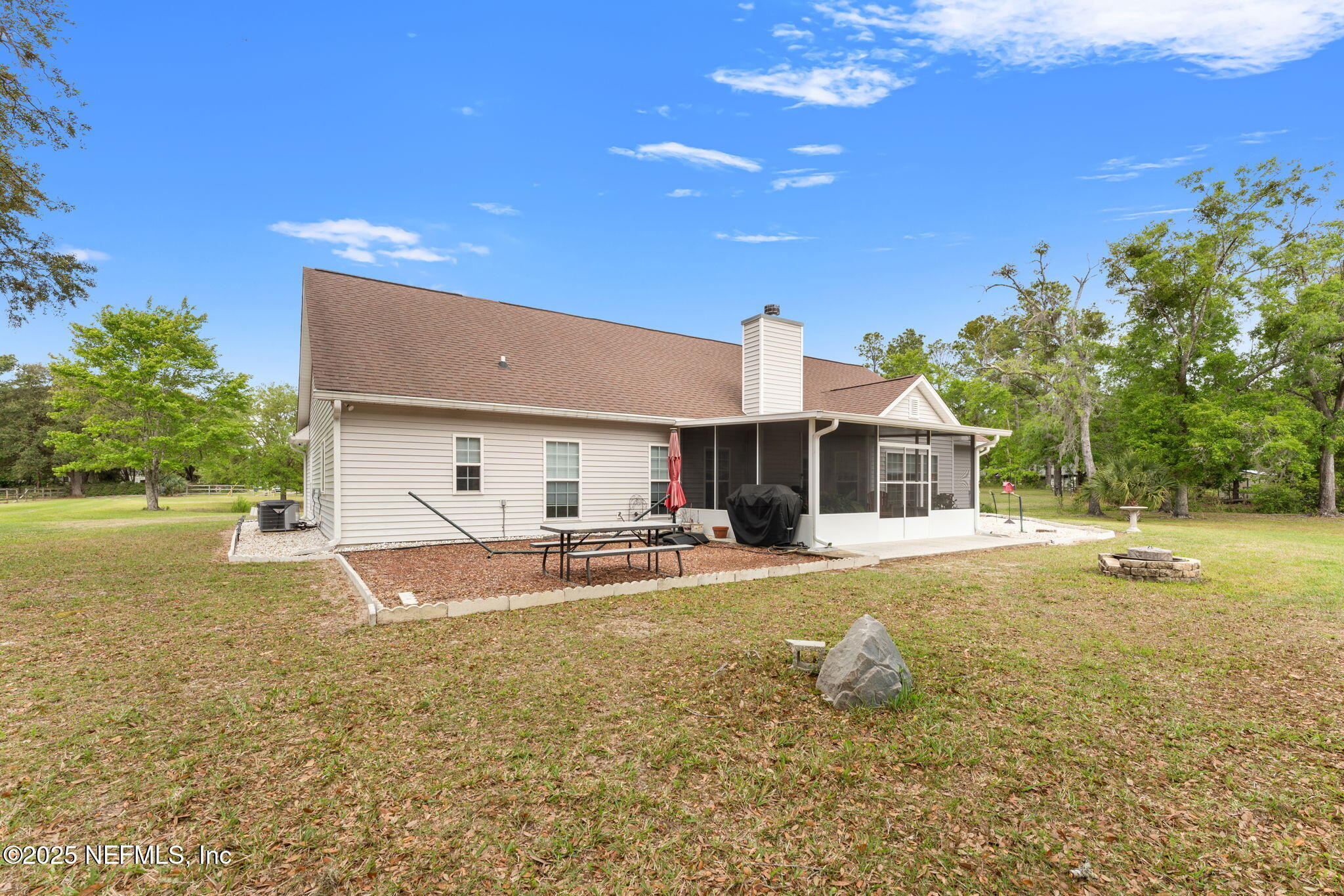 12869 Boney Road Jacksonville, FL 32226 - Photo 44 of 62 a view of a house with swimming pool and sitting area