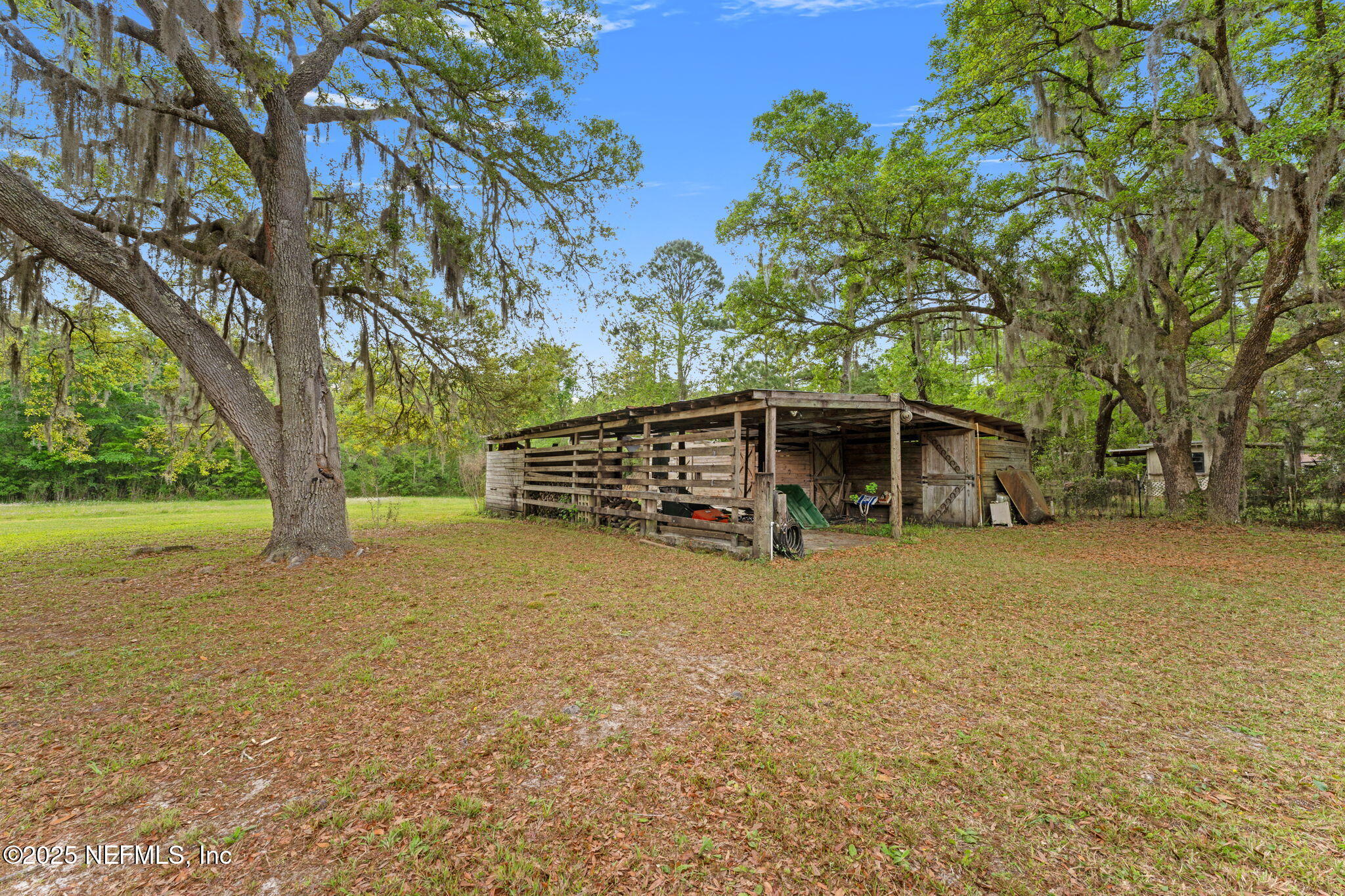 12869 Boney Road Jacksonville, FL 32226 - Photo 48 of 62 a big house with trees in front of it