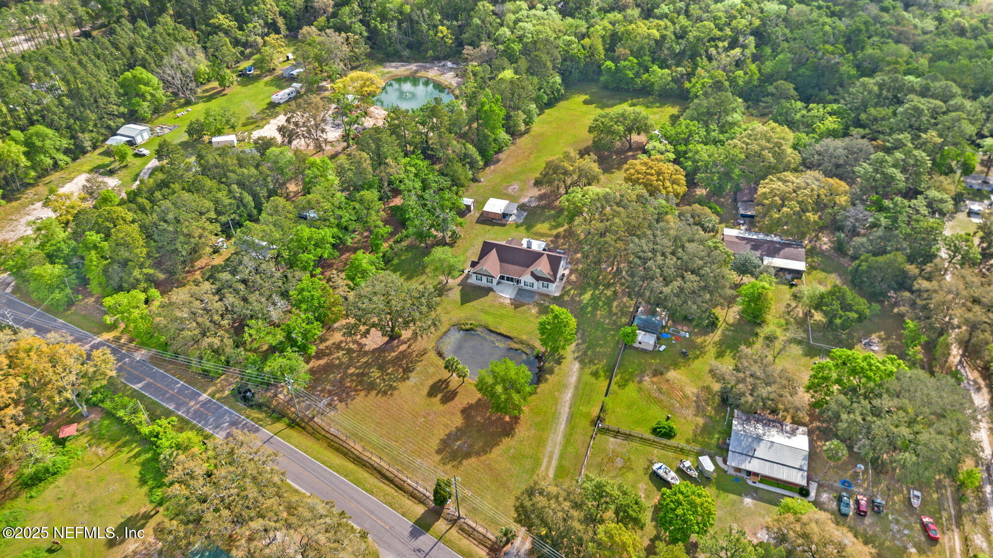 12869 Boney Road Jacksonville, FL 32226 - Photo 54 of 62 a backyard of a building with lots of trees