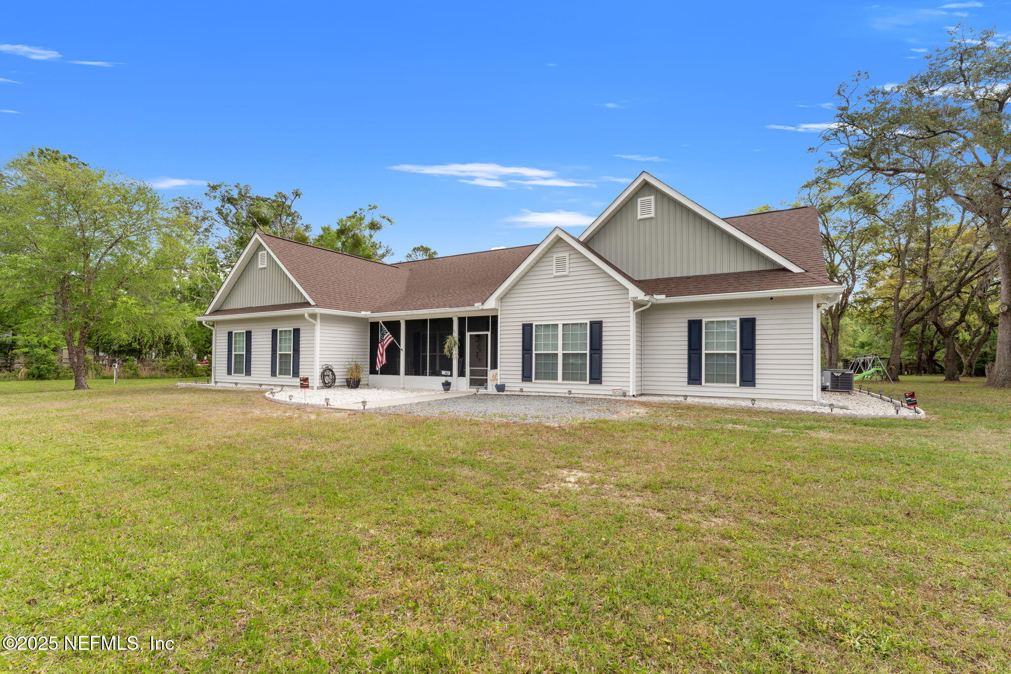 12869 Boney Road Jacksonville, FL 32226 - Photo 7 of 62 a front view of a house with swimming pool having outdoor seating