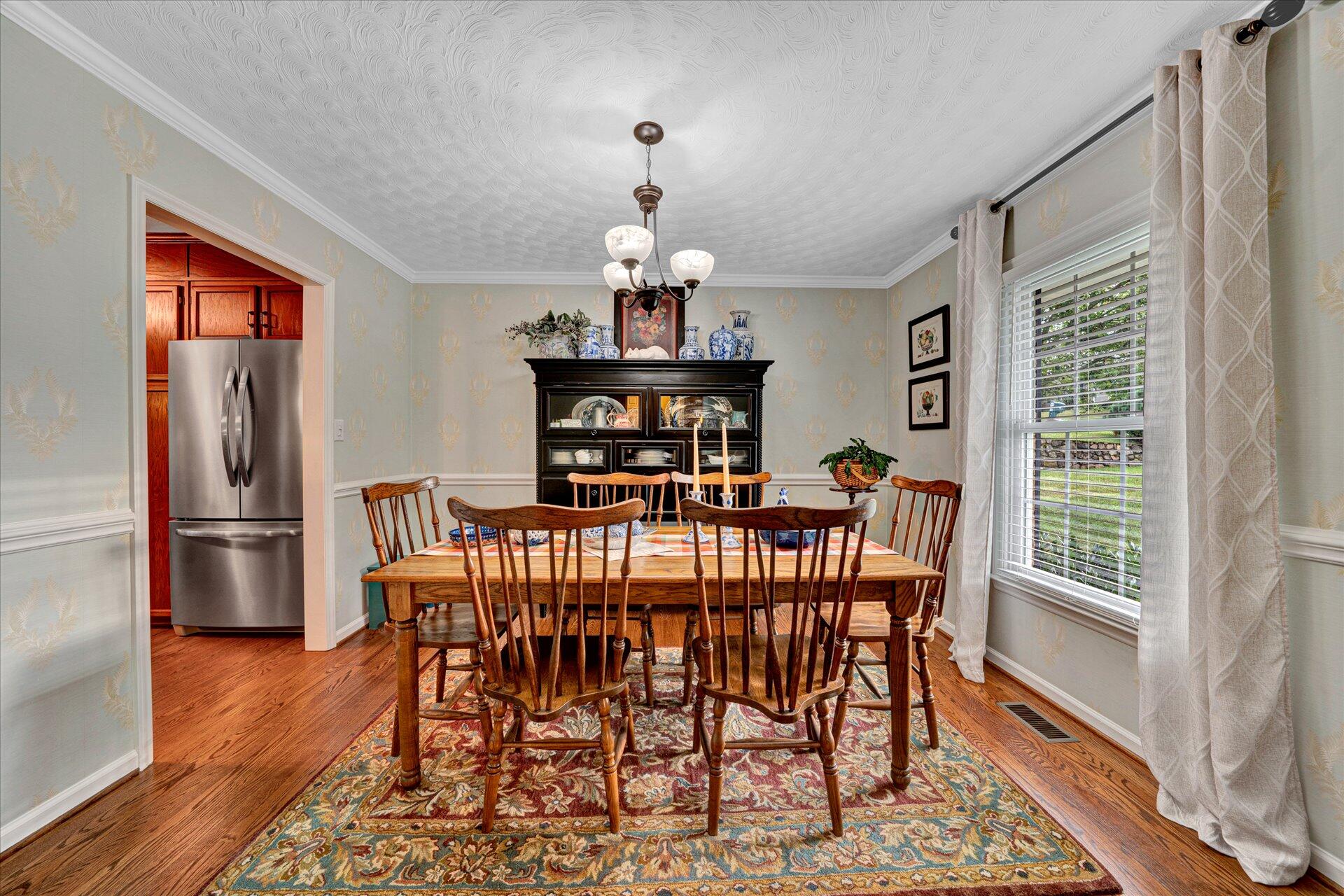 307 North Preston Road Vinton, VA 24179 - Photo 12 of 48 a view of a dining room with furniture wooden floor and a chandelier