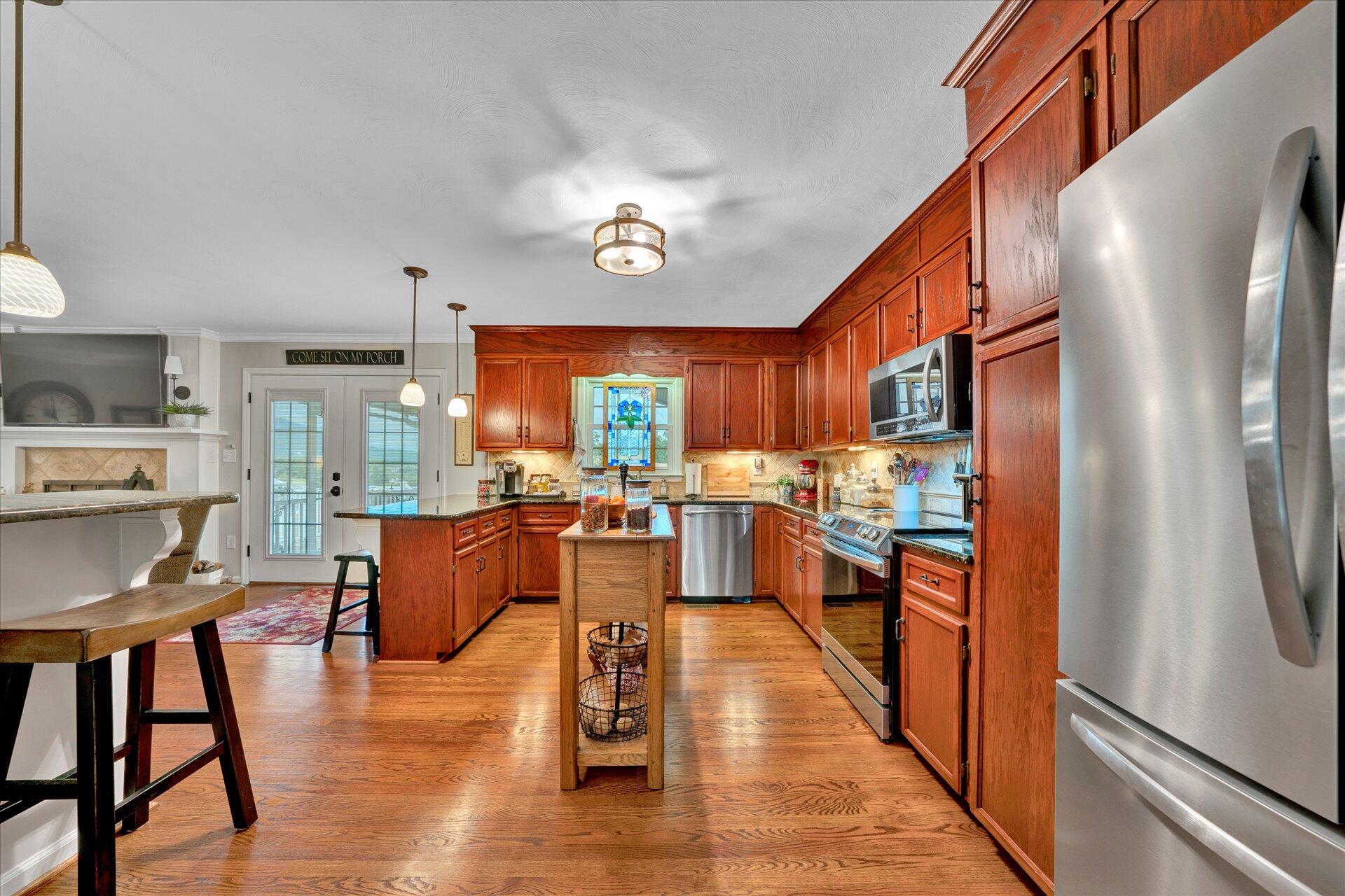 307 North Preston Road Vinton, VA 24179 - Photo 14 of 48 a living room with stainless steel appliances granite countertop furniture wooden floor and a large window