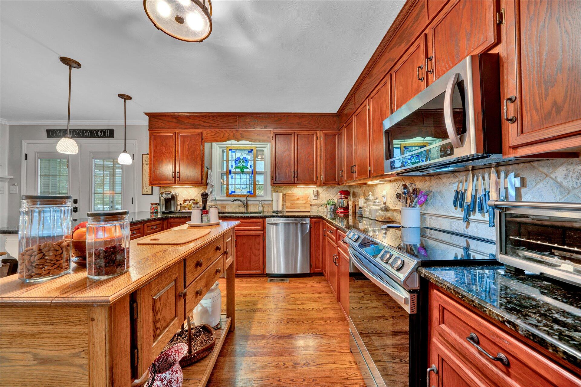 307 North Preston Road Vinton, VA 24179 - Photo 15 of 48 a kitchen with stainless steel appliances granite countertop a stove a sink and a refrigerator