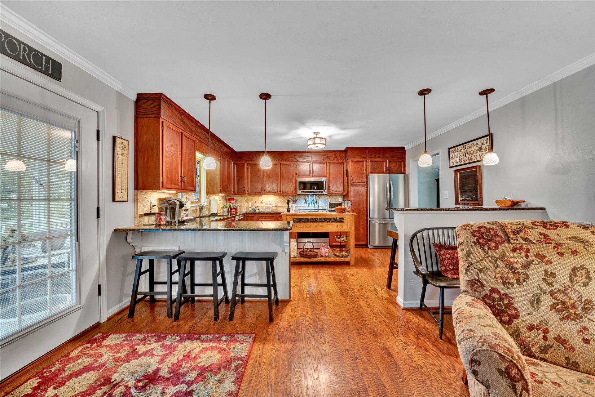 307 North Preston Road Vinton, VA 24179 - Photo 16 of 48 a dining room with stainless steel appliances granite countertop a stove and a wooden floors