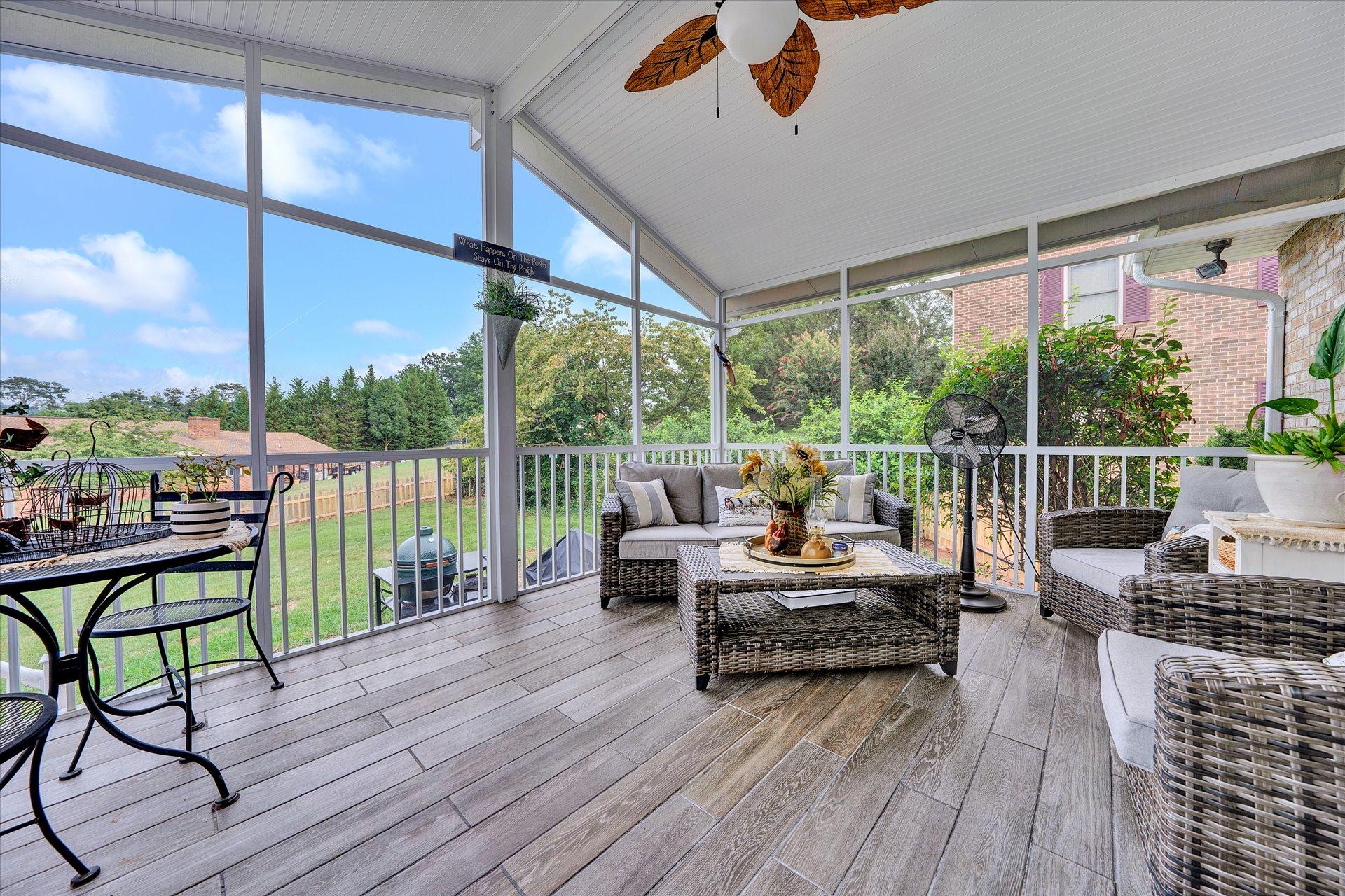 307 North Preston Road Vinton, VA 24179 - Photo 23 of 48 a living room with couch floor to ceiling windows and wooden floor