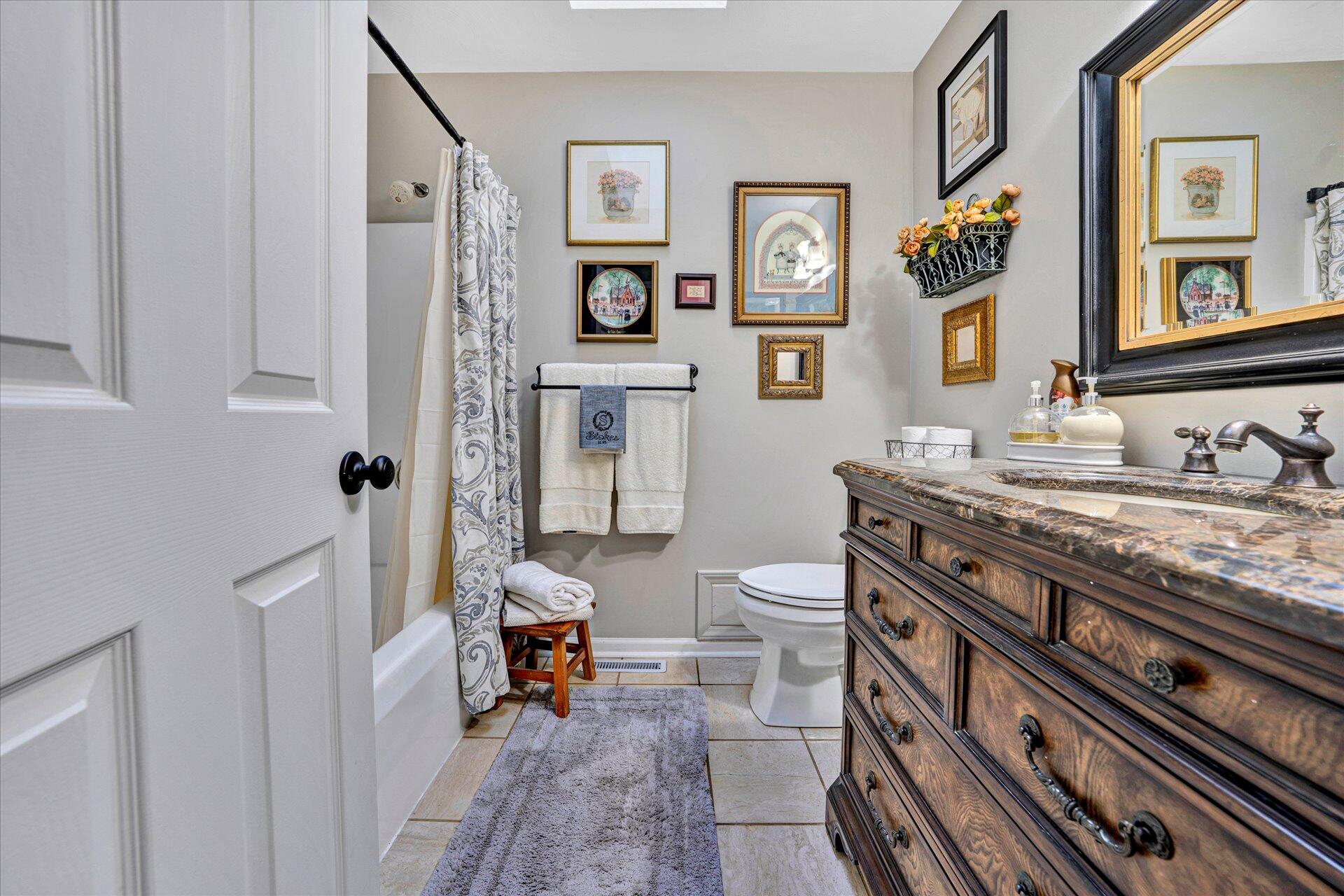 307 North Preston Road Vinton, VA 24179 - Photo 29 of 48 a spacious bathroom with a granite countertop sink a mirror and a toilet