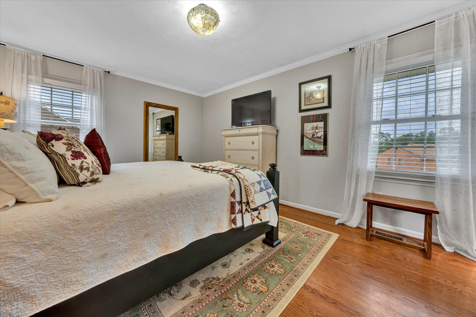 307 North Preston Road Vinton, VA 24179 - Photo 30 of 48 a bed sitting in a bedroom next to a window