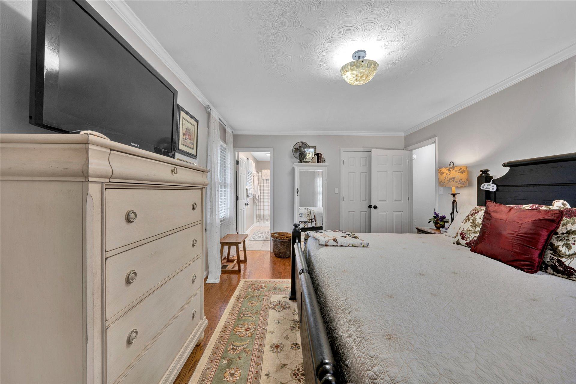 307 North Preston Road Vinton, VA 24179 - Photo 32 of 48 a bed room with a bed and a chandelier