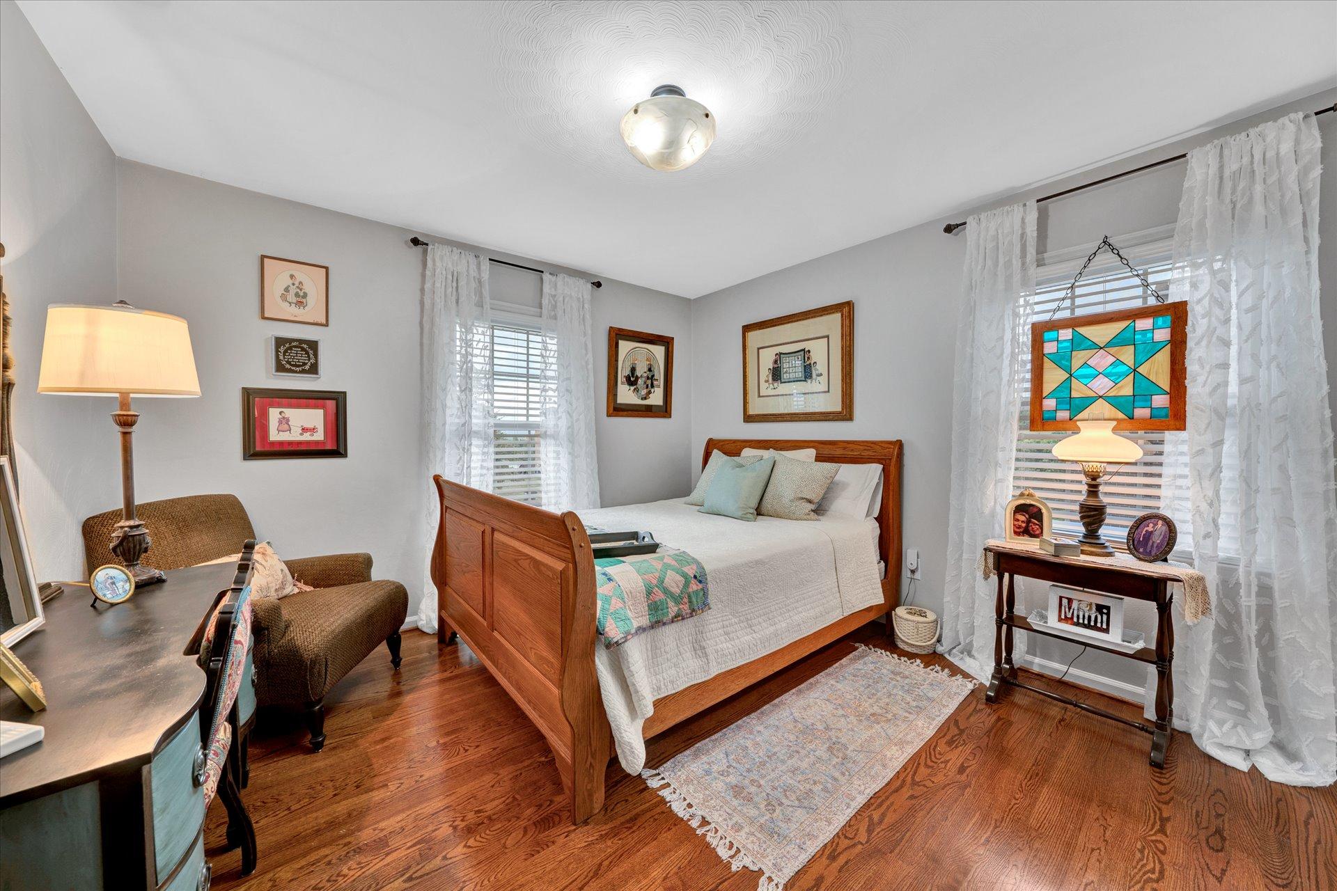 307 North Preston Road Vinton, VA 24179 - Photo 34 of 48 a bedroom with a bed and wooden floor