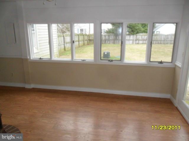 24610 Williston Road Denton, MD 21629 - Photo 2 of 17 a view of an empty room with a window