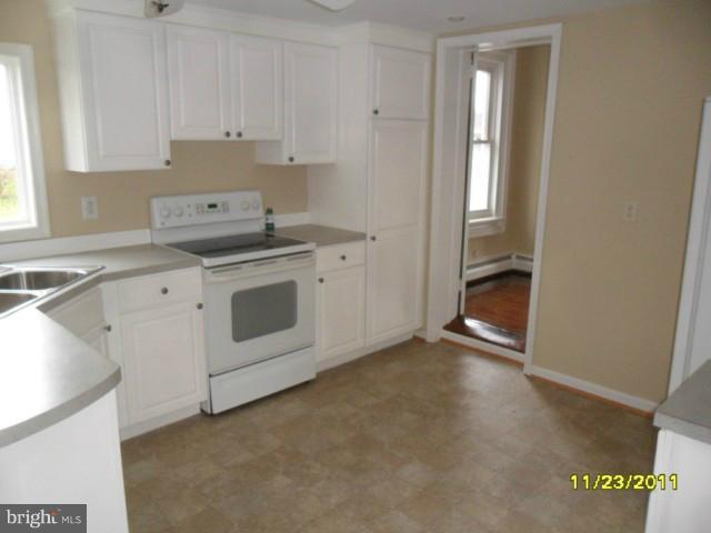24610 Williston Road Denton, MD 21629 - Photo 5 of 17 a kitchen with a stove and a sink