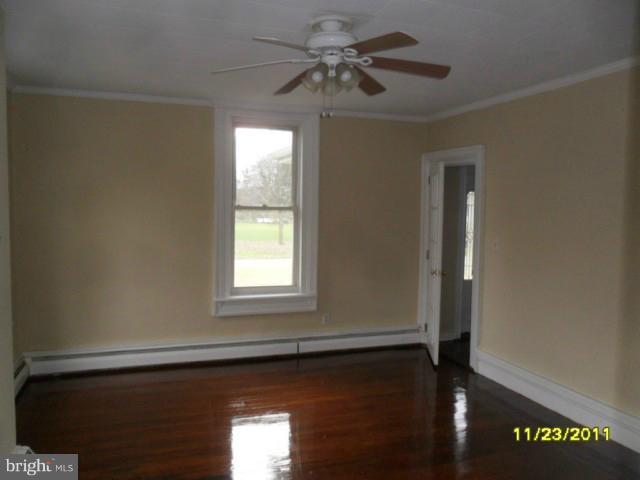 24610 Williston Road Denton, MD 21629 - Photo 7 of 17 a view of an empty room with a window