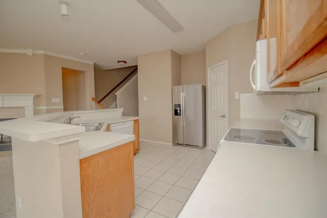 a bathroom with a sink and a washing machine