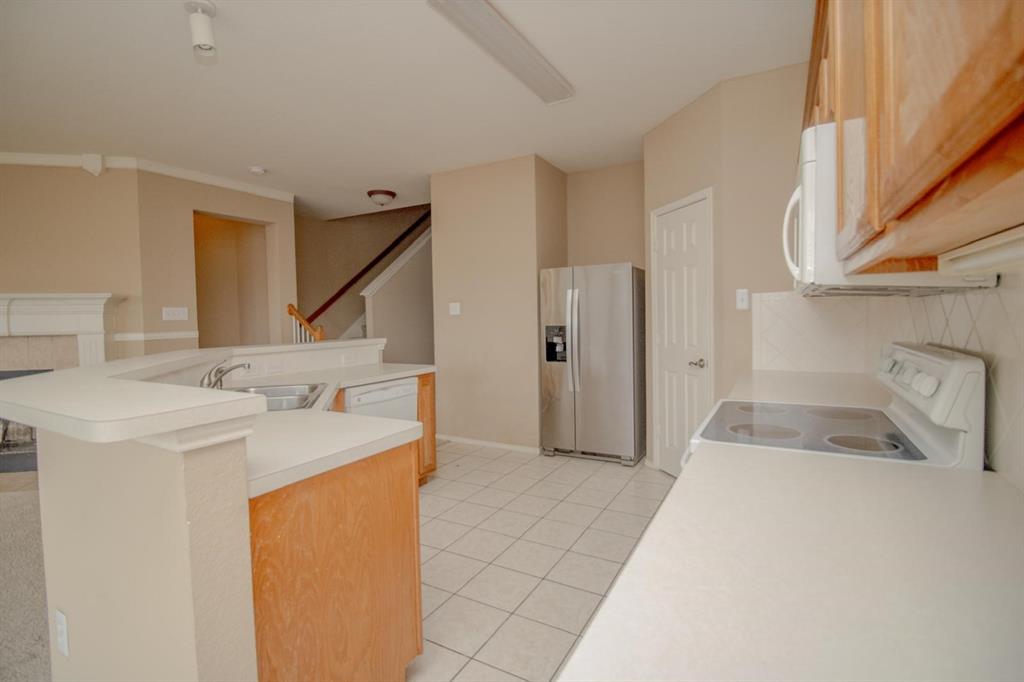 1100 Inland Lane McKinney, TX 75072 - Photo 12 of 36 a bathroom with a sink and a washing machine