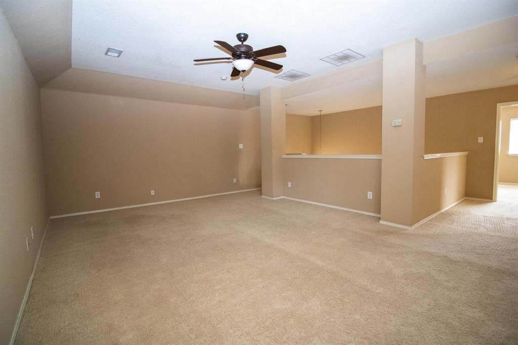 1100 Inland Lane McKinney, TX 75072 - Photo 16 of 36 a view of a room with a ceiling fan and a window