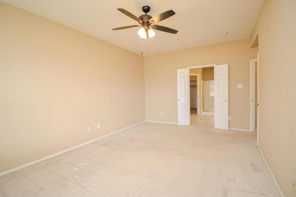 1100 Inland Lane McKinney, TX 75072 - Photo 20 of 36 a view of a room with a ceiling fan and a window