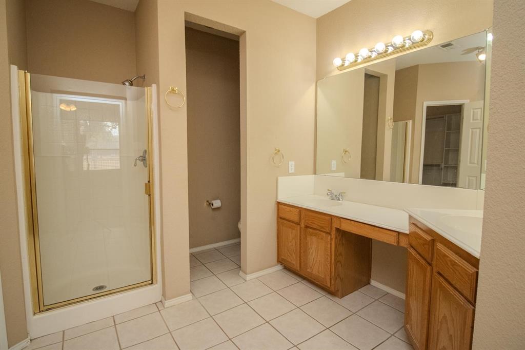 1100 Inland Lane McKinney, TX 75072 - Photo 21 of 36 a bathroom with a double vanity sink mirror and bathtub