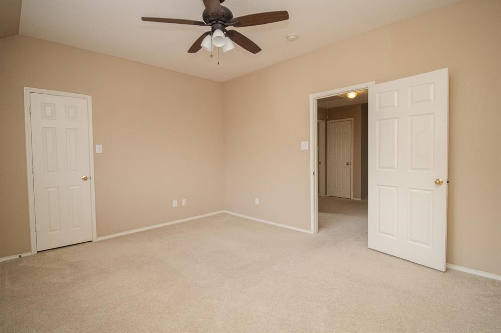1100 Inland Lane McKinney, TX 75072 - Photo 28 of 36 an empty room with windows and fan