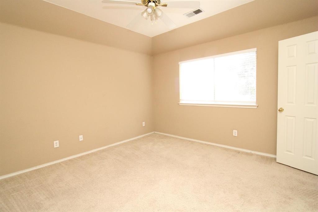 1100 Inland Lane McKinney, TX 75072 - Photo 29 of 36 an empty room with a window and a ceiling fan