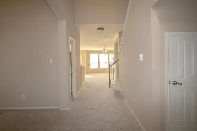 a view of hallway with livingroom