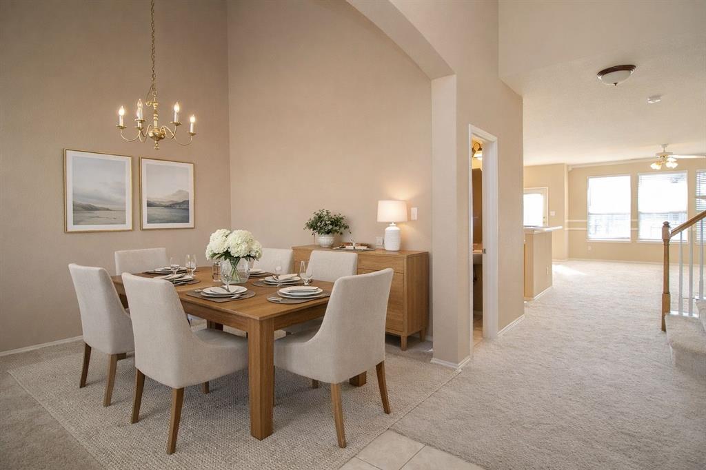 1100 Inland Lane McKinney, TX 75072 - Photo 7 of 36 a view of a dining room with furniture and chandelier