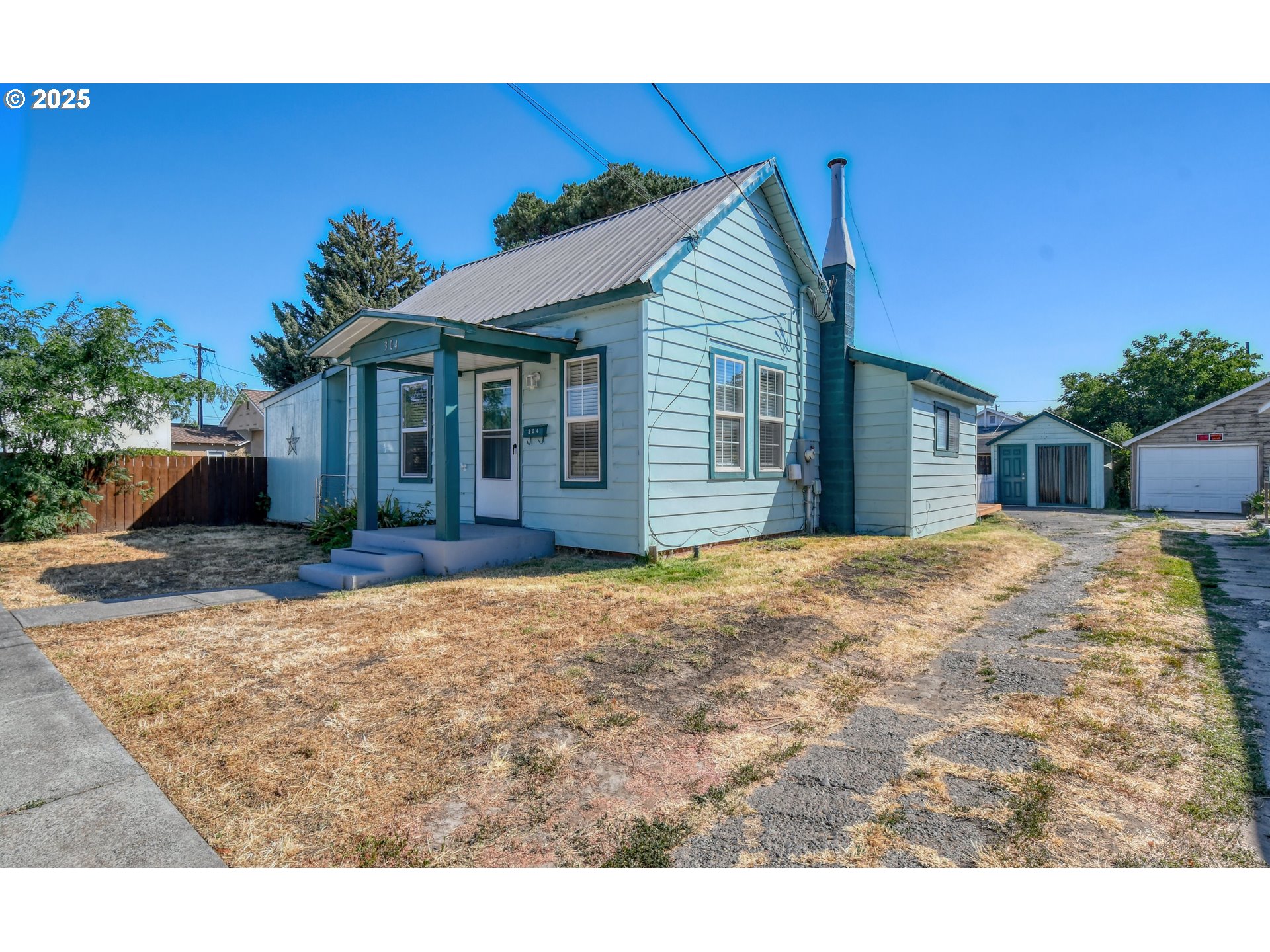 304 Southwest 16th Street Pendleton, OR 97801 - Photo 1 of 34 a view of a house with a backyard