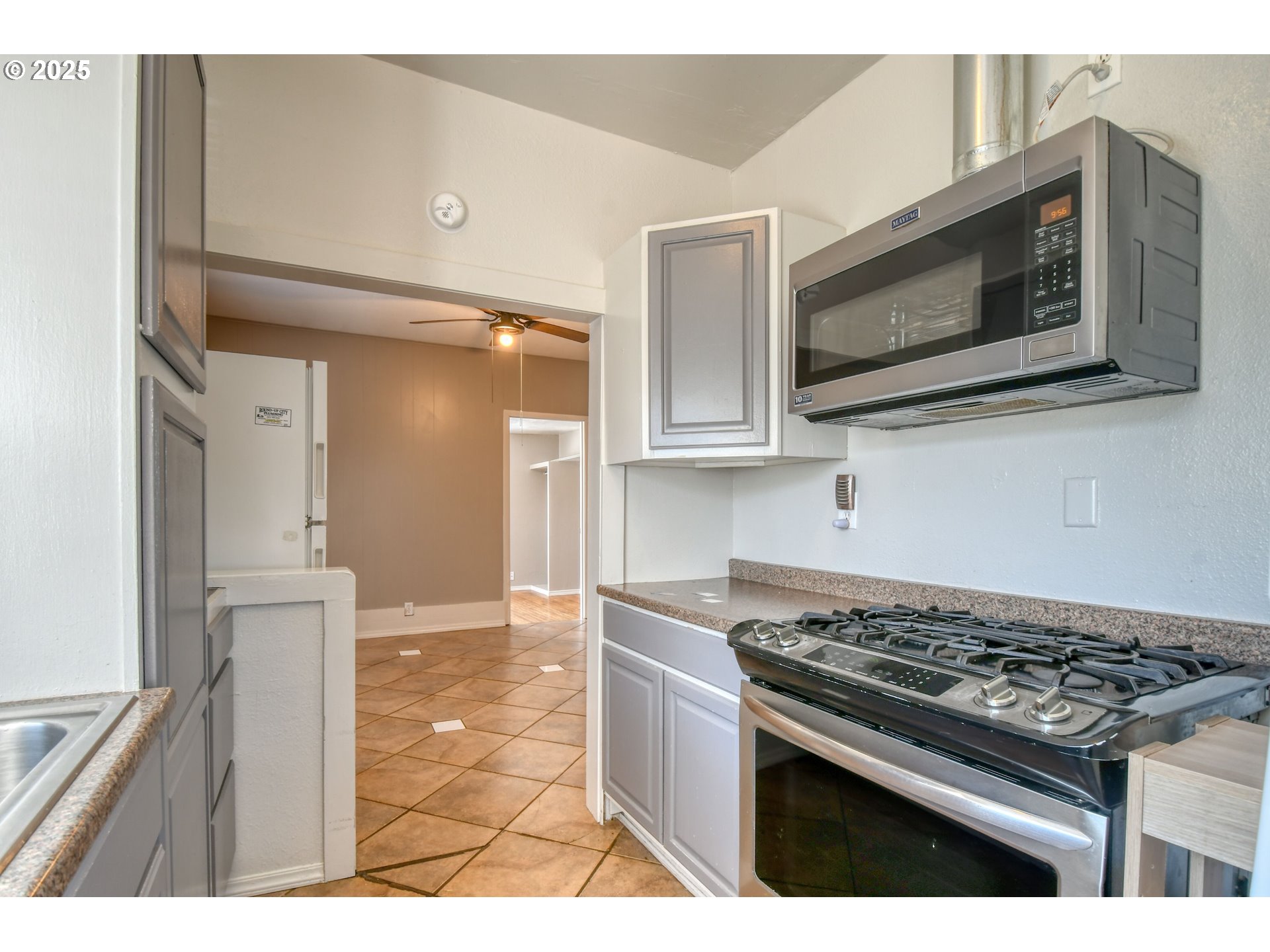 304 Southwest 16th Street Pendleton, OR 97801 - Photo 9 of 34 a kitchen with stainless steel appliances and cabinets