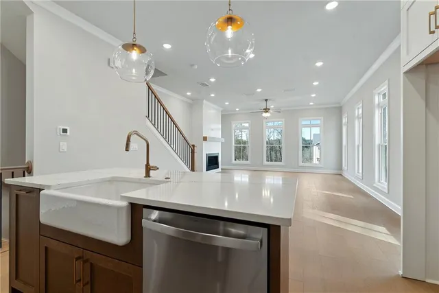 a view of a kitchen with a sink and chandelier