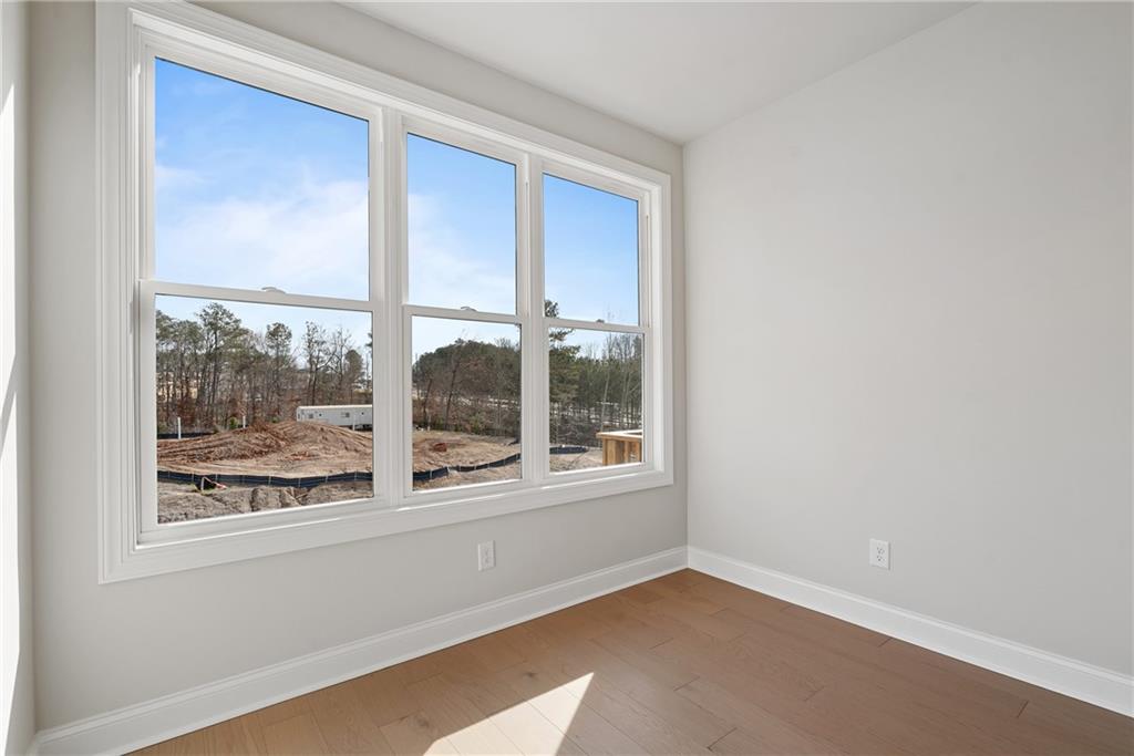 506 Whatton Road, Unit 3 Johns Creek, GA 30022 - Photo 22 of 36 a view of an empty room with a window