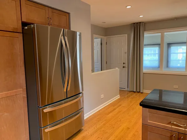 a view of a refrigerator in kitchen and a refrigerator