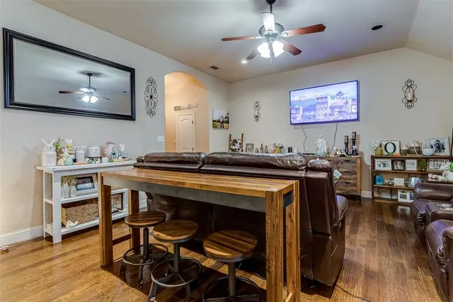 a view of a dining room with furniture and wooden floor