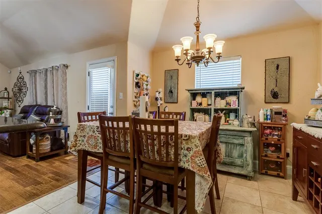 a dining room with furniture and window